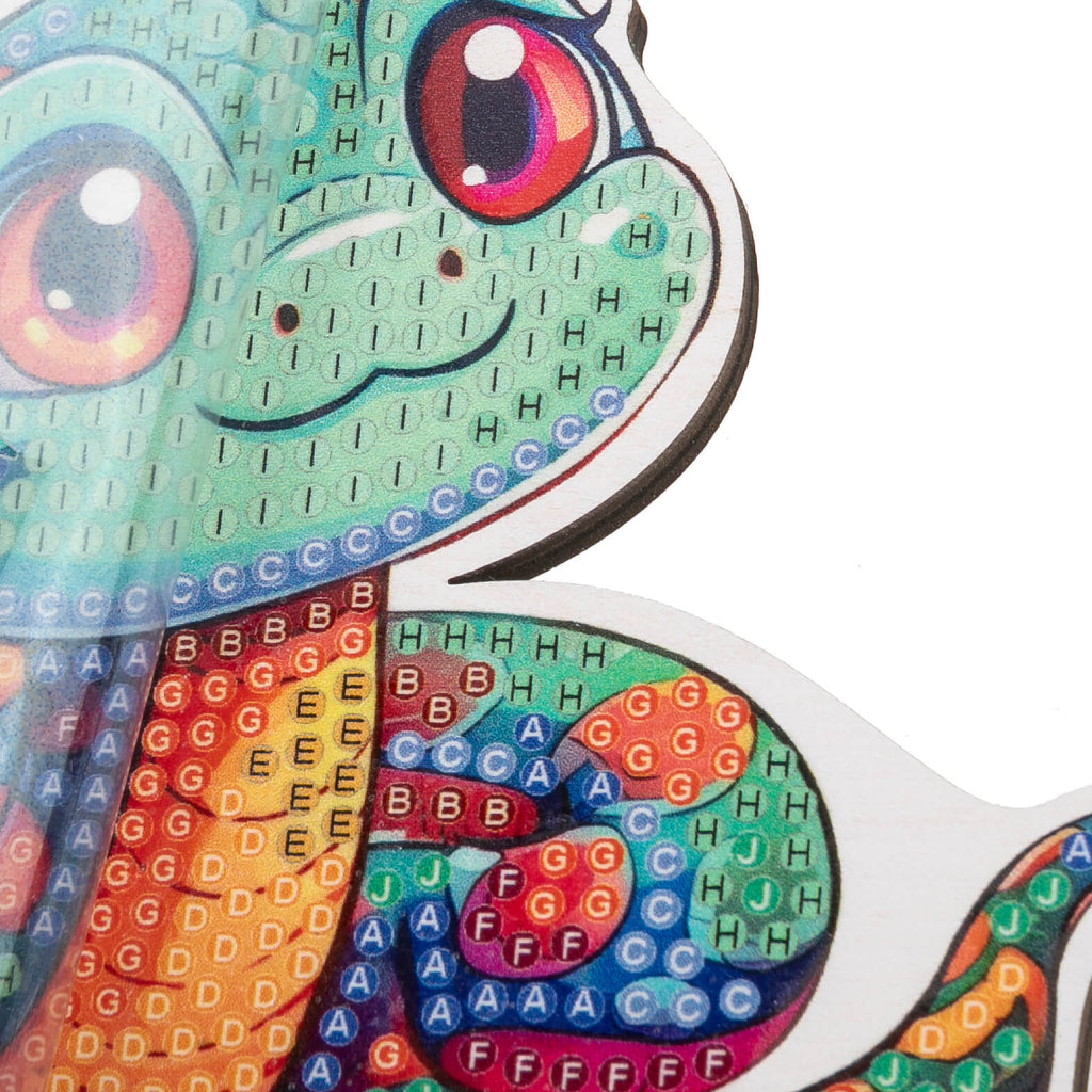 close up view of the Snake Crystal Art Wildlife Buddy, highlighting the coded adhesive template showing expected placement of crystals