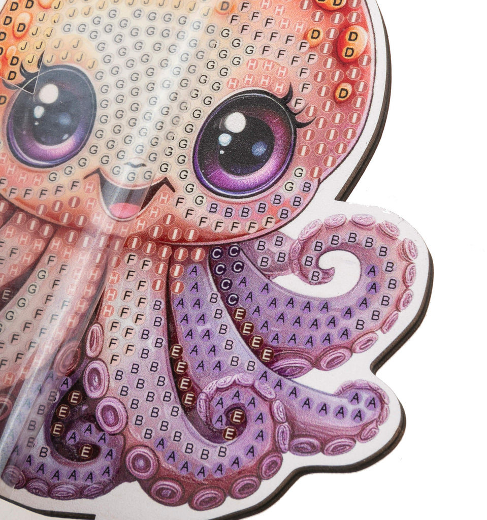 close up view of Octopus Crystal Art Wildlife Buddy,highlighting coded adhesive template showing placement of crystals