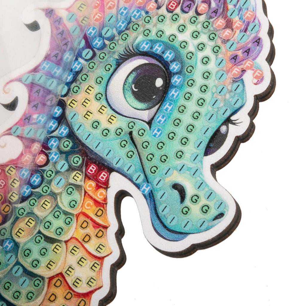 close up view of Seahorse Crystal Art Wildlife Buddy, highlighting coded adhesive template showing placement of crystals