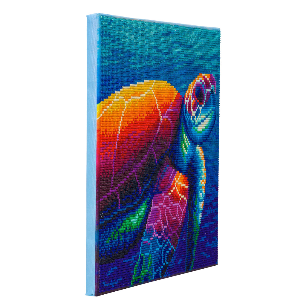 side view of completed sea turtle crystal art canvas, against white background