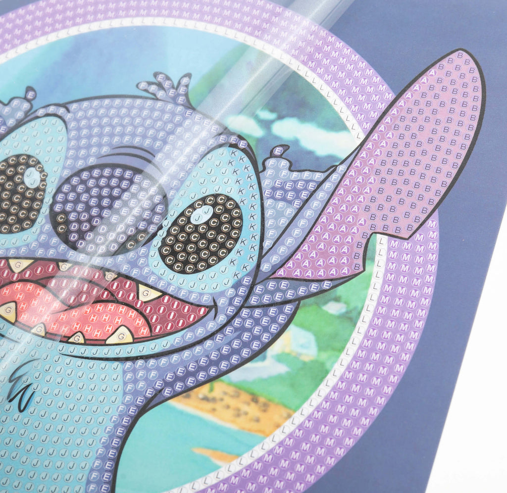 close up view of Stitch Crystal Art greetings card, showing coded adhesive template for placement of crystals