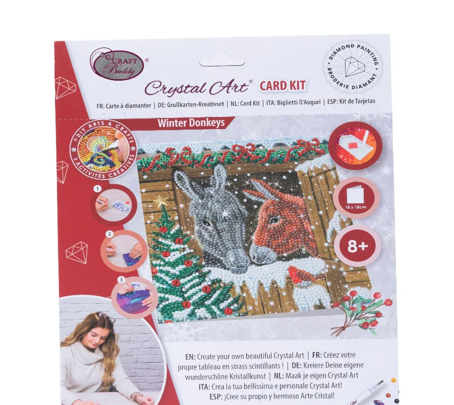 Winter Donkeys Crystal Art card kit packaging with donkeys and Christmas elements on a white background