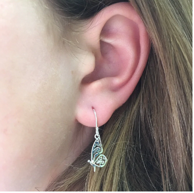 Model wearing Reeves & Reeves sterling silver butterfly earrings